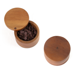 This image displays one of our Acacia Wood Salt Boxes with a swivel top containing chocolate chips.